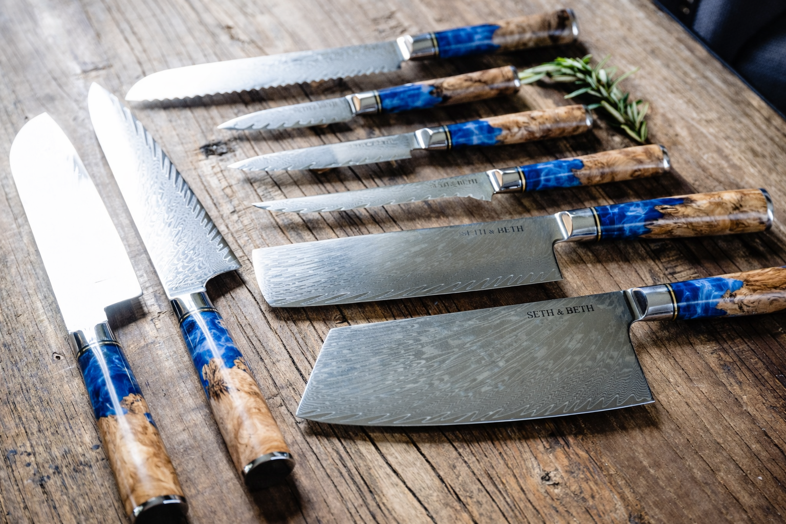 Blue burl handle close-up on personalized engraved Damascus knife — Tidal Collection
