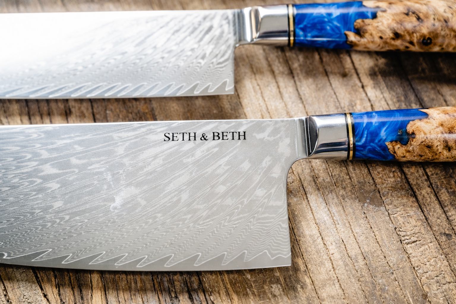 Blue burl handle close-up on personalized engraved Damascus knife — Tidal Collection
