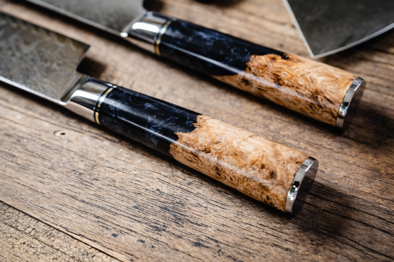 Black burl handle close-up on personalized engraved Damascus knife — Tidal Collection