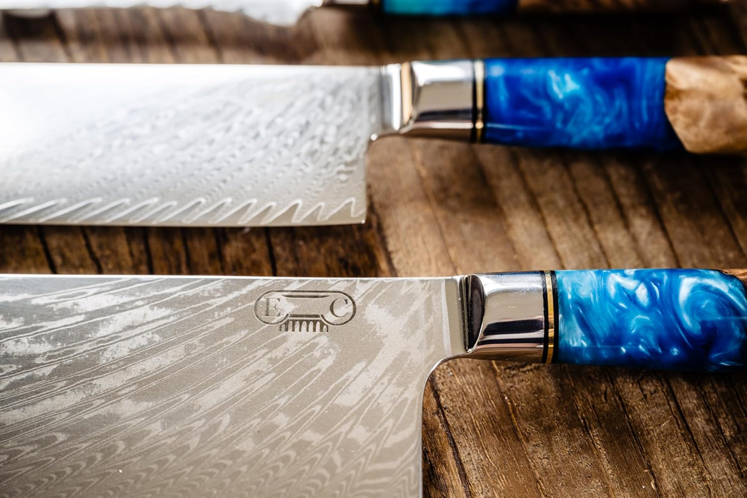 Close-up of 67-layer Damascus steel blade pattern on Tidal Collection chef knife